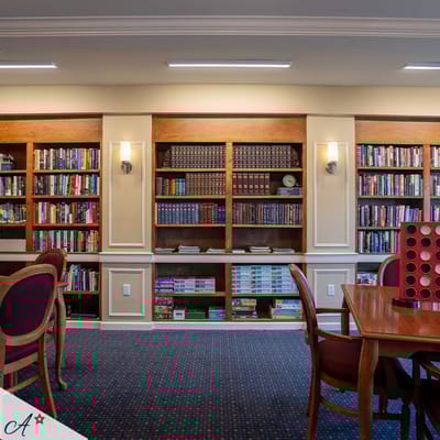Interior view of a library with bookshelves and tables