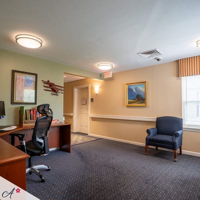 Cozy interior room with office and seating area