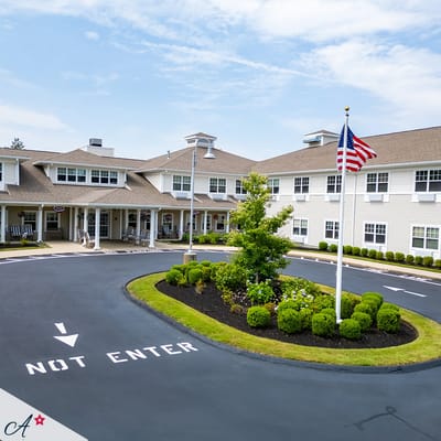 Exterior view of the assisted living facility with gardens