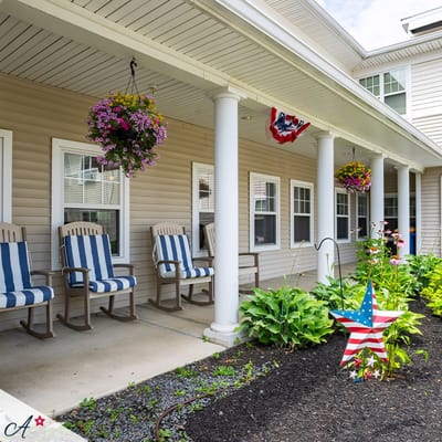 Outdoor porch with rocking chairs and flower decorations