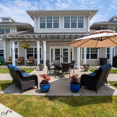 Outdoor seating area with patio furniture and flowers
