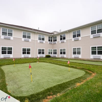 Putting green in a grassy outdoor area