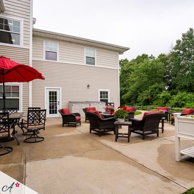 Outdoor patio area with seating and flowers