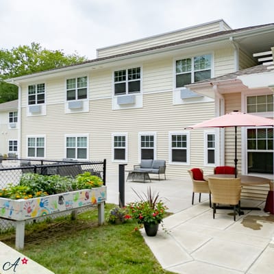 Outdoor patio area with seating and garden