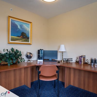 Corner office space with a desk and chair