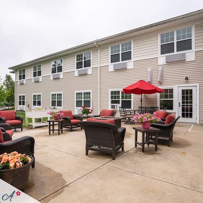 Outdoor seating area with flowers and umbrellas