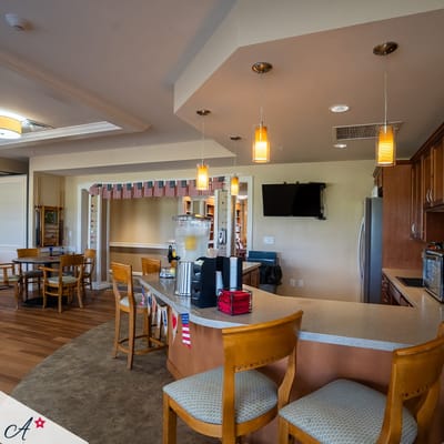 Bright common area with a kitchen and dining setup
