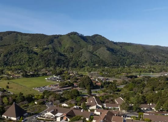 Aerial view of a community surrounded by mountains