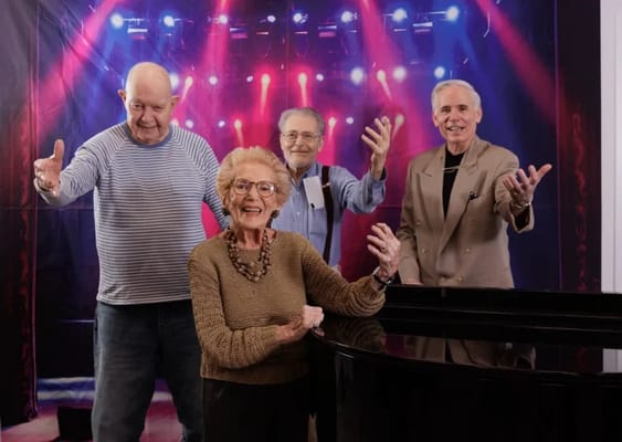 Residents enjoying a musical performance together