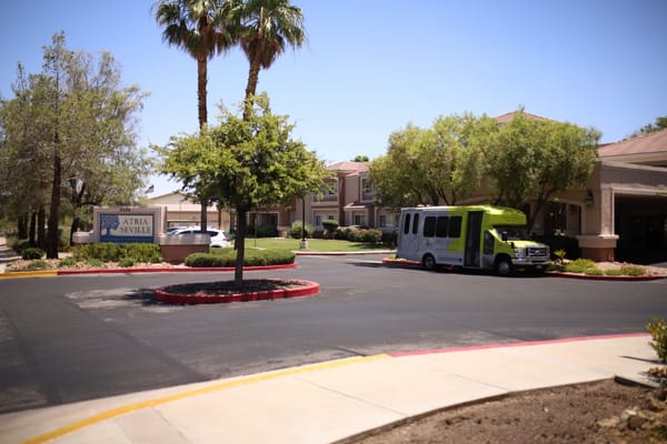 Exterior view of Atria Seville with facility transport