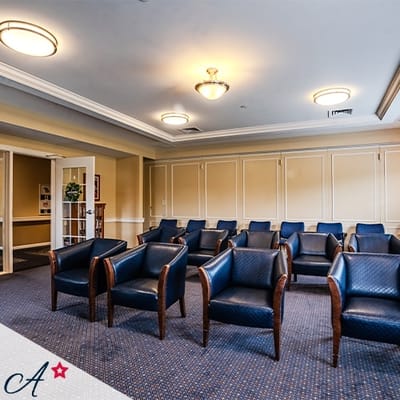Seating area in a common room with blue chairs