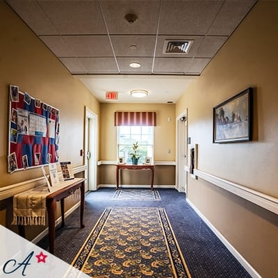 Interior hallway with floral decorations and bulletin board