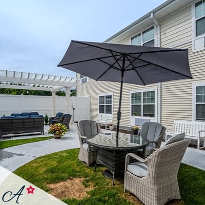 Outdoor seating area with table and umbrellas