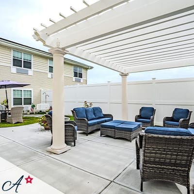 Outdoor seating area with wicker chairs and a table