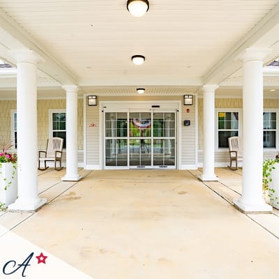 Entrance of an assisted living facility with rocking chairs