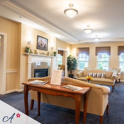 Cozy common area with seating and a fireplace