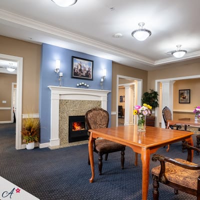 Bright common area with seating and decorative flowers
