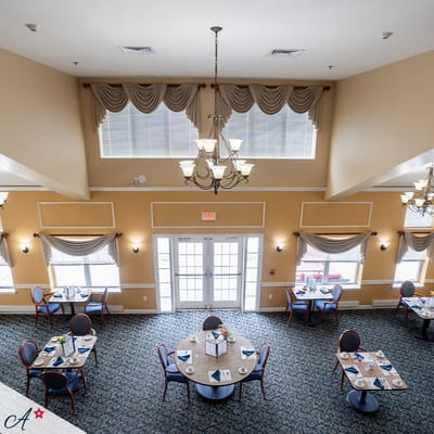 Dining room setup with tables and chairs