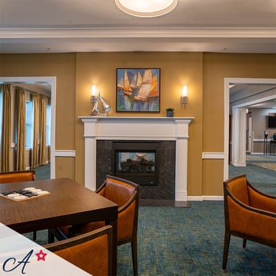 Bright common area with seating and fireplace