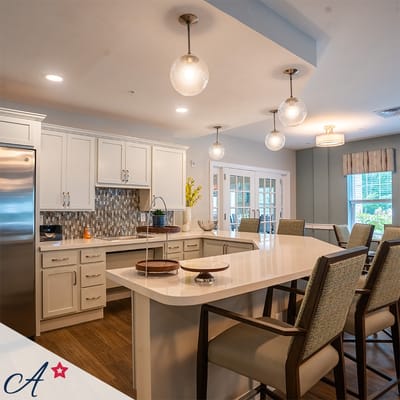 Bright, modern kitchen area with seating