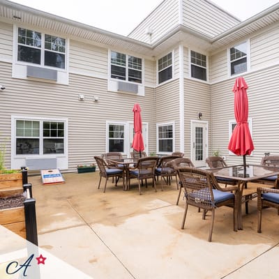 Outdoor patio area with seating and umbrellas