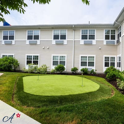 Well-maintained outdoor putting green at the facility