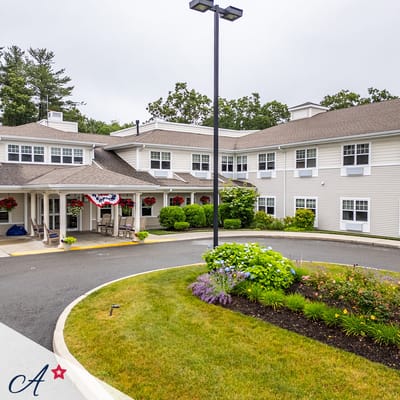 Front exterior view of the assisted living facility with landscaping