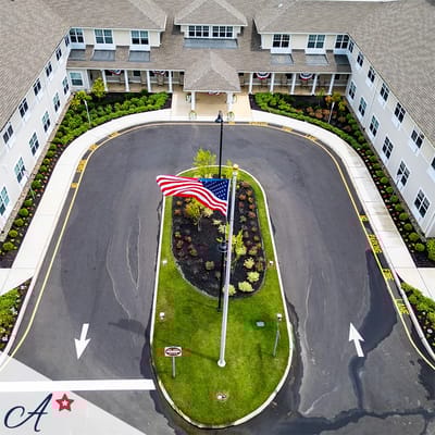 Aerial view of the entrance with garden and American flag