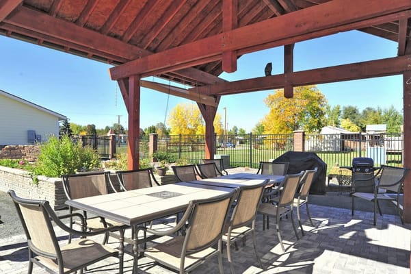 Outdoor seating area with tables and chairs