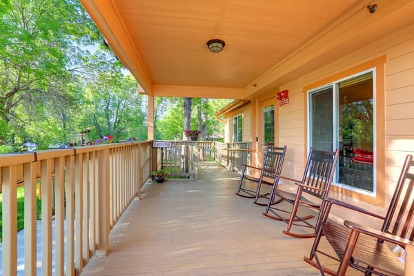 Outdoor porch area with rocking chairs