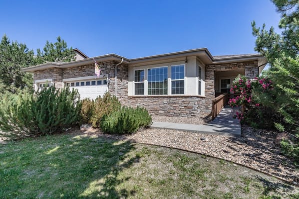 Exterior view of a senior living facility with landscaping