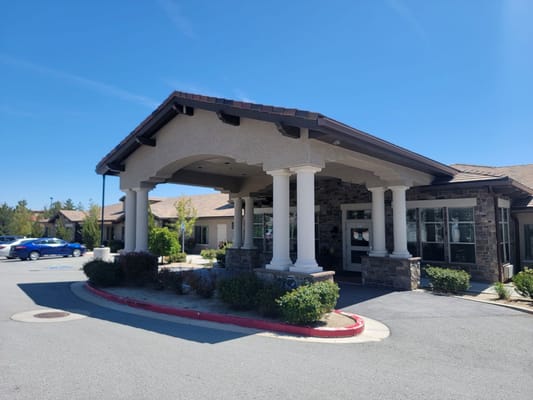 Welcoming entrance of Stone Valley Memory Care facility with landscaped grounds