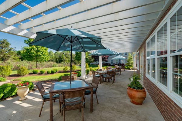 Outdoor patio area with tables and umbrellas