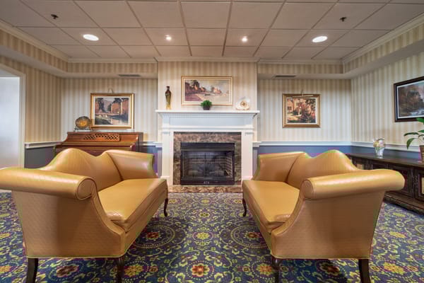 Cozy common area with seating and a fireplace