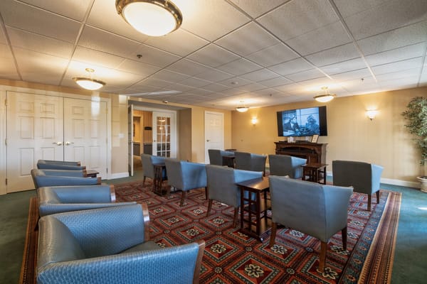 Bright common area with seating and television