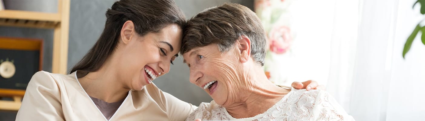 Caregiver and resident enjoying a moment together