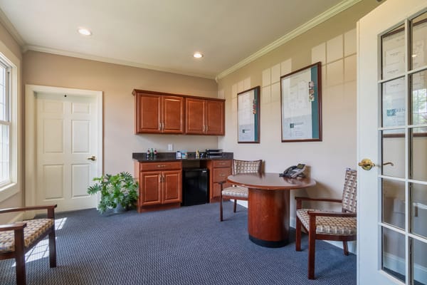 Bright common room with seating and windows
