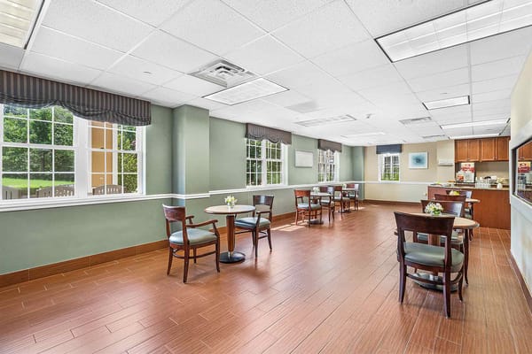 Bright common area with tables and chairs