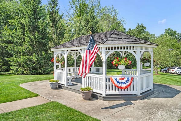Outdoor gazebo in a green landscaped area