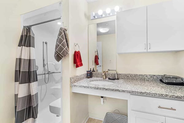 Updated bathroom in a resident room with modern fixtures