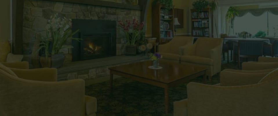 Cozy lounge area with a fireplace and seating