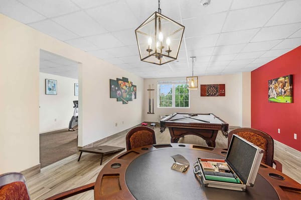 Interior common area with a pool table and seating