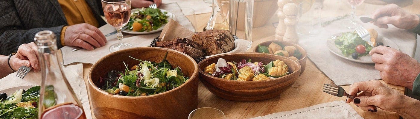 Residents enjoying a meal at a dining table