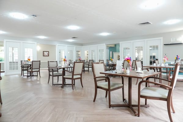 Dining area with tables set for residents