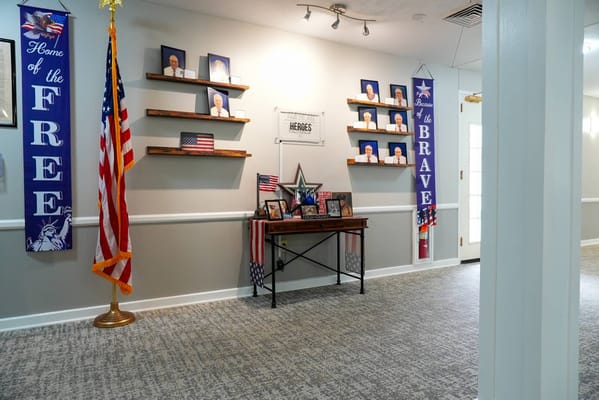 Interior decor honoring veterans with flags and photos
