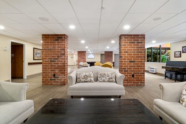Interior common area with seating and piano