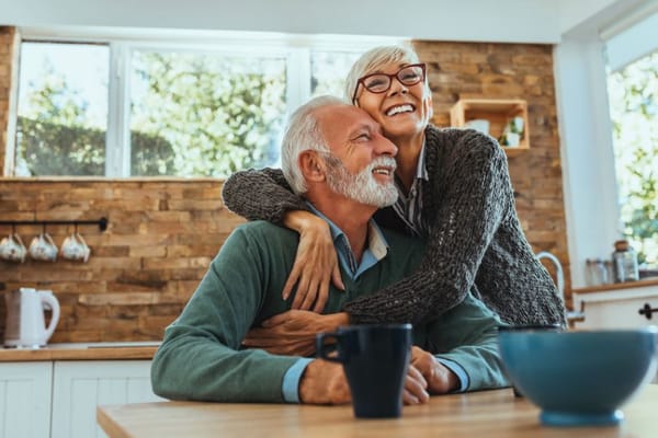 Smiling couple enjoying time together in a cozy kitchen