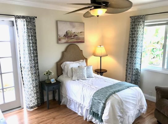 Cozy resident room with a single bed and light decor