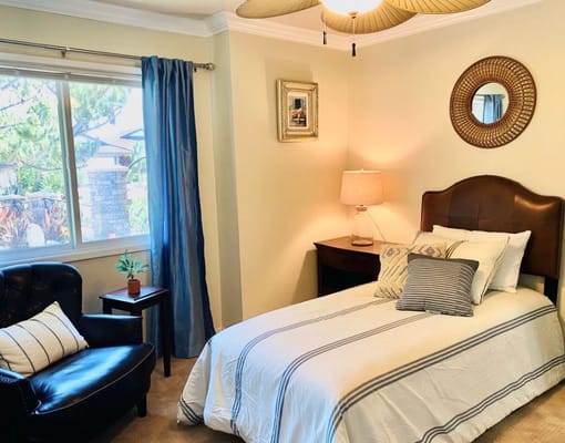 Cozy private resident room with bed and chair