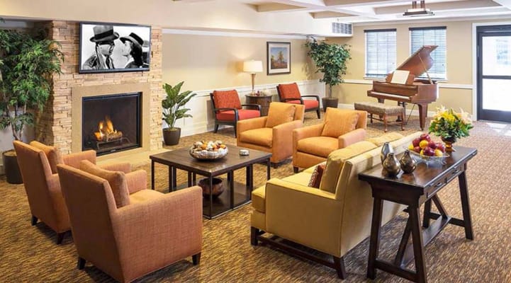 Cozy common area with chairs and fireplace